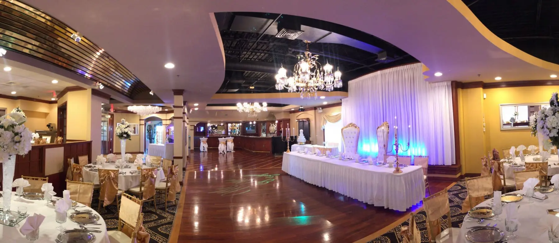 A large room with many tables and lights