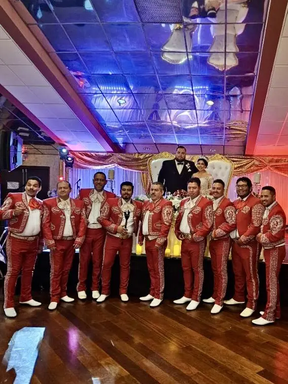 A group of men in red and white suits.