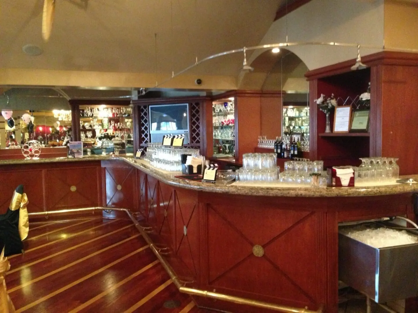 A bar with many wooden cabinets and counters