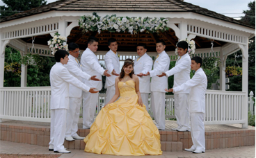 A group of men in white suits and one woman in yellow dress.