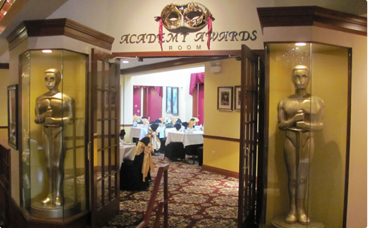 A room with an entrance to the academy awards.