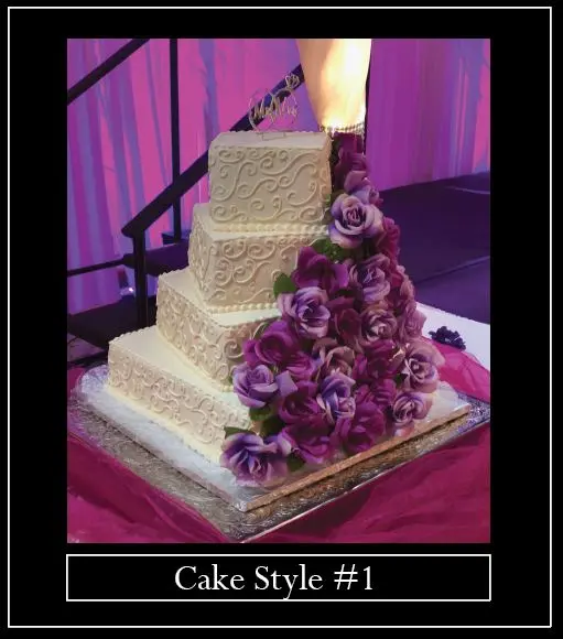 A picture of a cake with purple flowers on it.